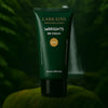 Labrains BB Cream Light with Warm Undertones tube, 50 ml, op een mossige rots met een waterval en groene jungle-achtergrond.